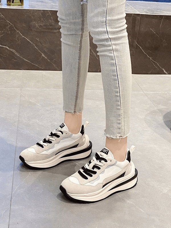 Stylish women's sports sneakers with platform, suede uppers, mesh lining, and lace-up design for everyday comfort.